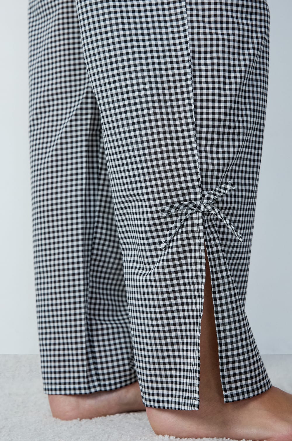 Straight-cut cotton pyjama trousers with checkered pattern and bow details;${refinementColor}